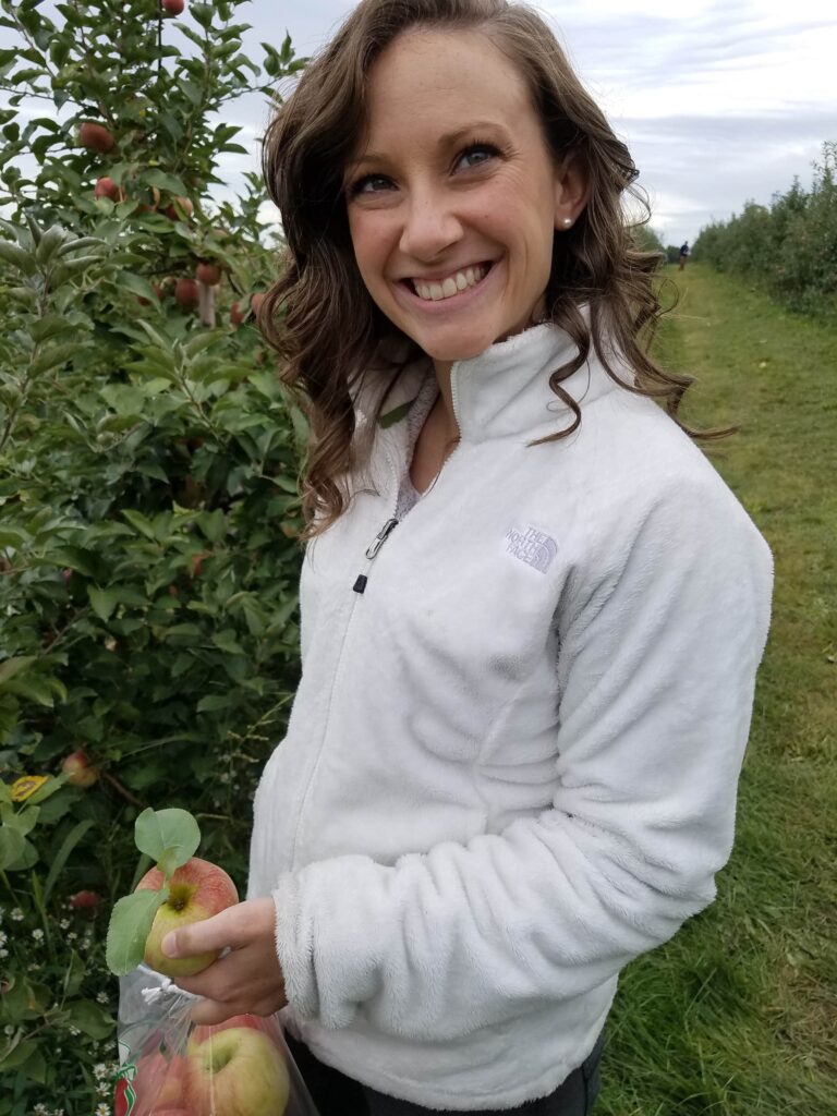 Jamie picking apples